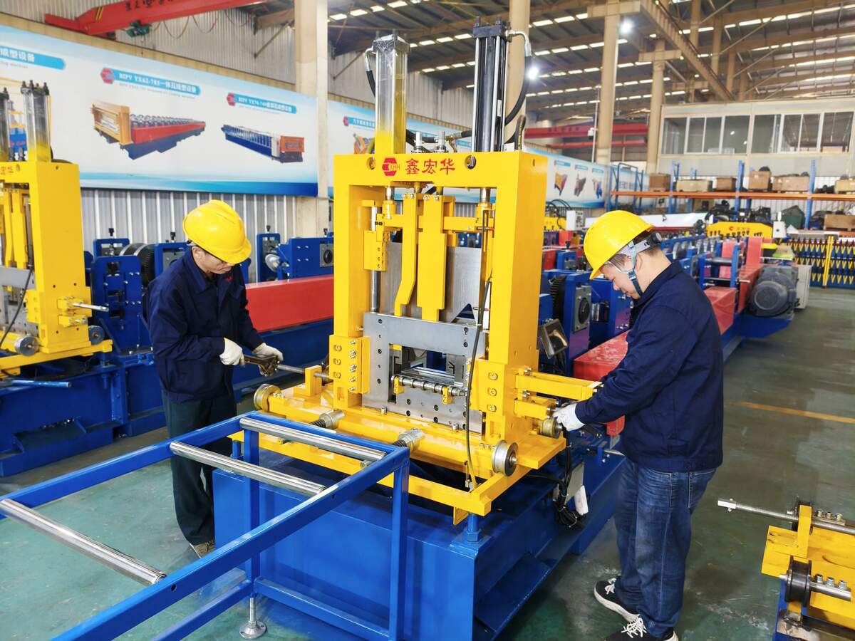 Xinhonghua technicians assembling a C/Z purlin roll forming machine